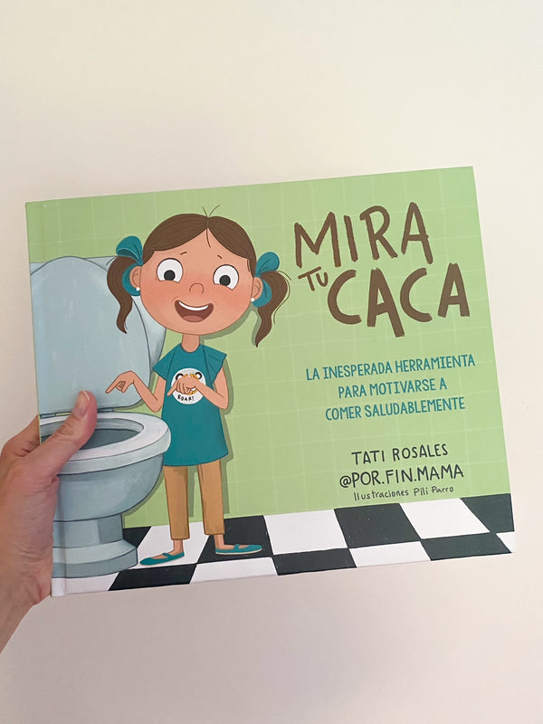 Libro infantil Mira tu caca sobre mesa con páginas coloridas abiertas
